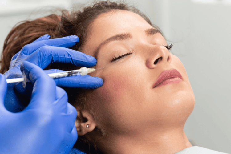 Woman receiving Botox touch-up for smooth, youthful skin at Elite Medical Spa.
